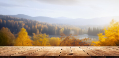 Naklejka na ściany i meble Empty wooden table with autumn landscape banner. Selective focus on tabletop. 