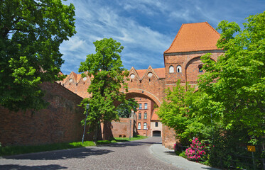 Fototapeta na wymiar Bricked gate Gdanisko in Torun, Poland in sunny summer day.