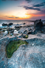 Sunset at the rocky beach at Vila Nova de Gaia, Portugal.