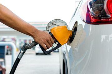 Man Refill and filling Oil Gas Fuel at station. Gas station - refueling.