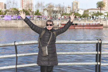 Happy tourist posing in Paseo Victorica, Tigre, Buenos Aires Province, Argentina