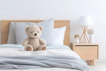 Fotobehang Cute teddy bear on bed in bedroom.  © Anna