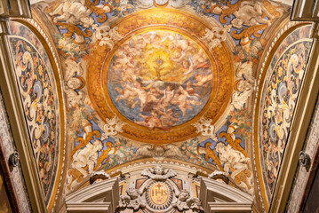NAPLES, ITALY - APRIL 19, 2023: The ceiling fresco of Eucharist among the angels in St. Francis Borgia chapel in the church Chiesa del Jesu Vecchio by  unknonw artist from 17. cent. - obrazy, fototapety, plakaty