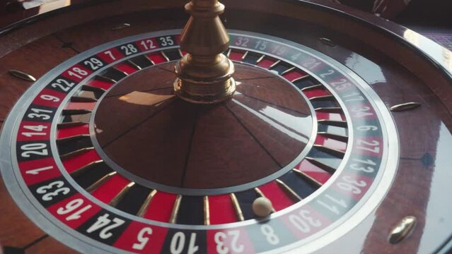 Casino roulette in motion with ball, spinning ball wheel make bets