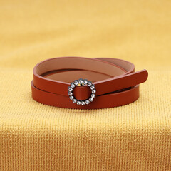 brown belt on a yellow background top view