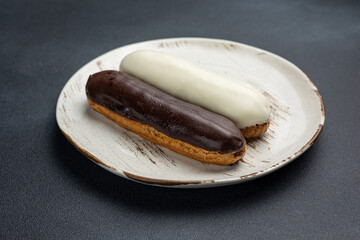 delicious dessert on a plate. Black background. Close up 