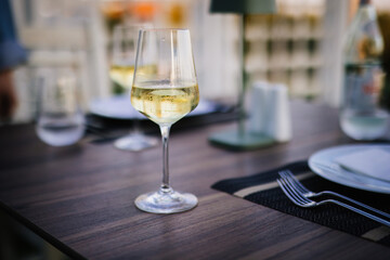 Wine glass on a table setting at restaurant