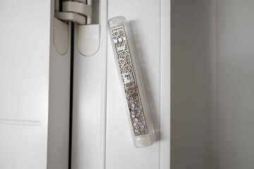 Mezuzah door jamb. Attaches to an external and internal  door jamb in a Jewish house. Mezuzah is a must-have item in a Jewish home. Hebrew letters shin and hai