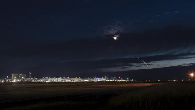 Time lapse YVR airport at dusk with main airport terminal, departure gates, and airplanes taking off and landing, Vancouver International Airport. 4K 24FPS PRORES 422