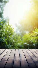 Wooden table with plant leaves - blurred green garden nature background - can be used to display products