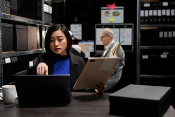 Asian manager accountant checking annual profit revenue paperwork before business consulting...