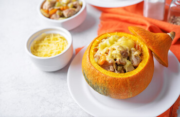 Pumpkin stuffed with chicken and carrots with celery