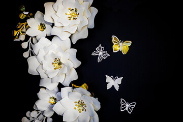 beautiful white decorative flowers with butterflies on a dark background. Holiday, wedding, holiday background