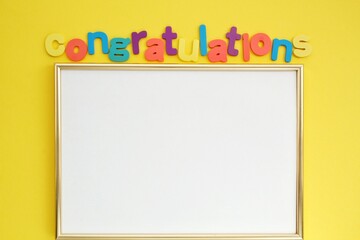 Colorful alphabet word Congratulations and frame on yellow background. Graduation concept. Primary...