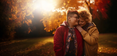 Lesbian couple in love, girlfriends hugging in nature at sunset, autumn season. Romantic scene between two loving women, female gay tenderness.