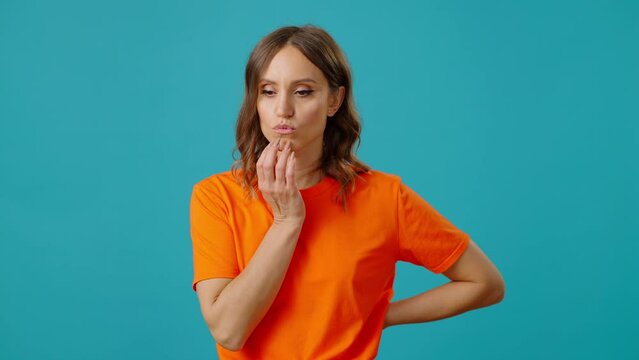 Pensive woman touches chin pondering difficult question