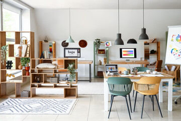 Interior of office with graphic designer's workplaces