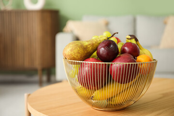 Fruit basket on coffee table in living room, closeup