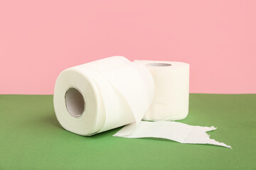 Rolls of toilet paper on colorful background