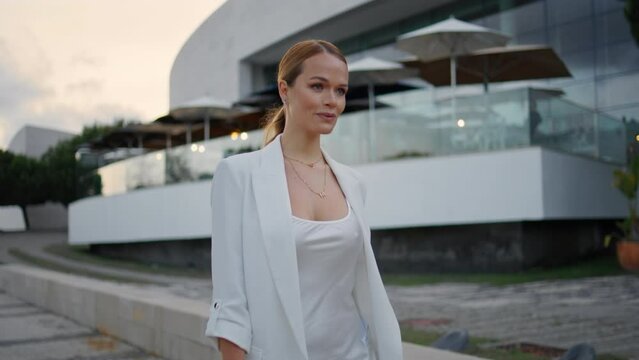 Glamorous businesswoman enjoy walk summer evening closeup. Happy woman strolling