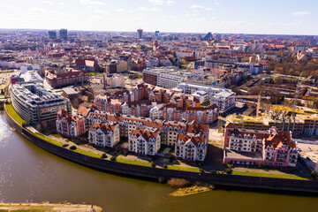 Aerial view of Poznan modern residential areas on bank of Warta River on sunny spring day, Poland - obrazy, fototapety, plakaty