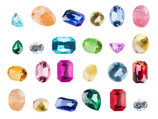 Set of different shiny gemstones for jeweler isolated on white