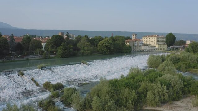 Flying over Ivrea river and waterfalls