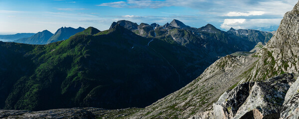 Horizontal high resolution panorama of green luscious details in Norwegian mountains seen from Smaltinden, Luröy, Helgeland, Nordnorge. Green mountains. Hills of norway. Nordic coastline High contrast