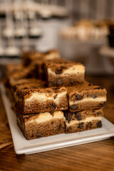 Close up of blondie bars with chocolate chips on wood table top