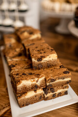 Close up of blondie bars with chocolate chips on wood table top