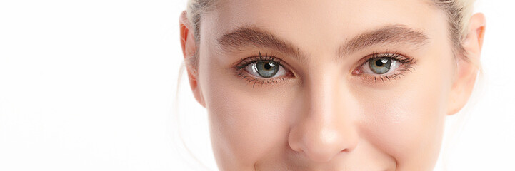 Close-up shot of beautiful woman's eyes on white background.