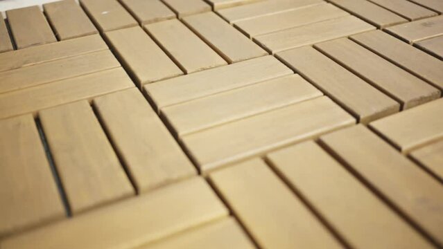 Close Up Of A Wood Deck Tiles on the Floor. - slide