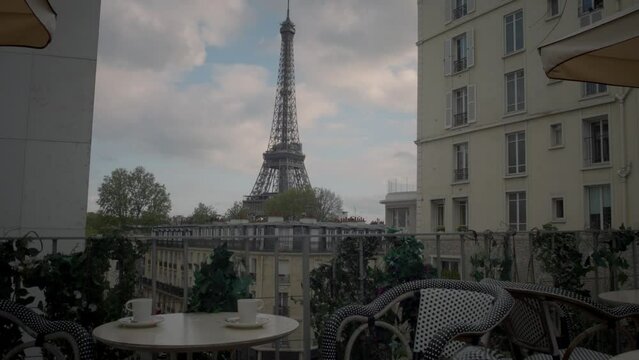 Cup of coffee with on a sunny day in the background of the Eiffel Tower. Paris, France.