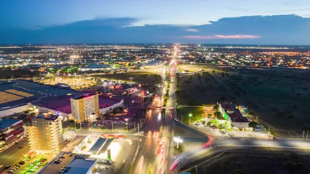 Magnificent aerial time lapse over Reynosa, an border city in the northern part of the state of Tamaulipas, in Mexico. Evening time video getting colorful light of the city.