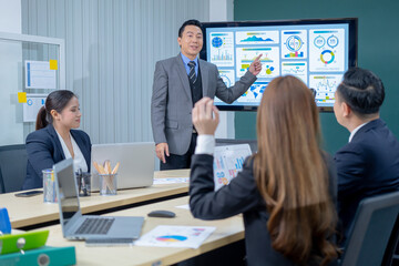Office Conference Business Meeting Presentation: asian Business people group meeting Talks, Uses Wall TV to Show Company Growth with Big Data Analysis, Graphs, Charts, Infographics, e-Commerce Startup