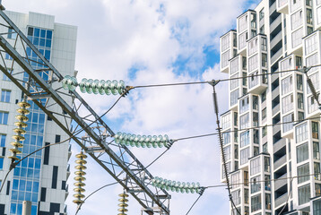 Glass insulators are installed on the power lines. Electrical substation for receiving, converting...
