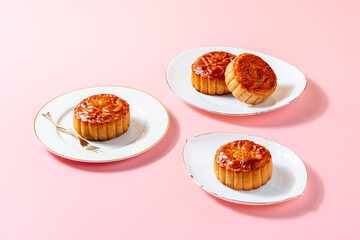 A mooncake  is a Chinese bakery product traditionally eaten during the Mid-Autumn Festival.