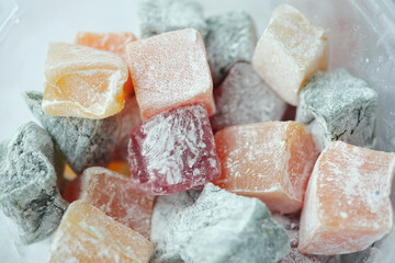  turkish delight or lokum of red, green, orange and yellow colors. - obrazy, fototapety, plakaty