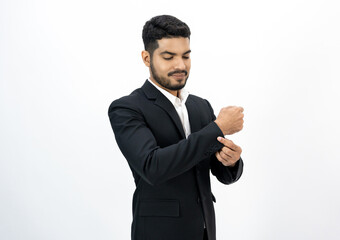Confident businessman buttoning or adjust classic blue suit on isolated white background. Handsome man wearing a nice suit