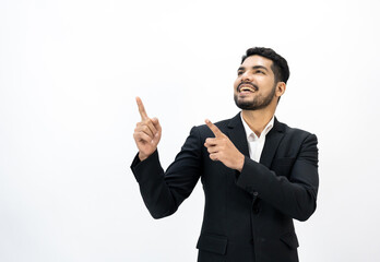 Pointing finger to blank space. Happy Young asian businessman on isolated white background. Handsome businessman in office suit uniform.