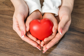 Close up mom and daughter hand holding heart mockup. Love relationship mother and child family concept.