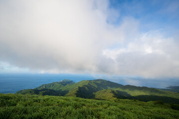 Transforming Vistas: Mountain Summit, Clouds, and Sunlight in Flux. Viewing platform of Caoshan Radar Station in Ruifang, New Taipei City. Taiwan