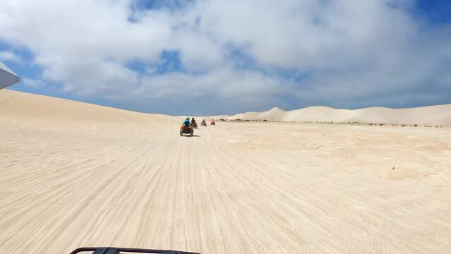 Quad biking at Lancelin Sand Dunes, Western Australia.