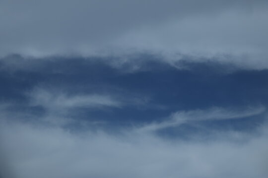 Heavenly photo of clouds looking like white cotton in blue sky, useful as a wallpaper or as a background image 