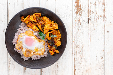 stir fried chicken with red curry paste, bergamot leaves, pepper with rice and egg in ceramic plate, top view, flat lay, copy space for text, Thai food, Gai Pad Prik Gaeng, Spicy Red Thai Stir Fry