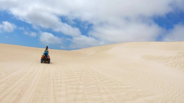 Quad biking at Lancelin Sand Dunes, Western Australia.