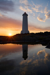 Beacon on lakeside in twilight