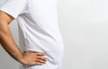 Man touching his fat belly on white background. Paunch of a man. Overweight
