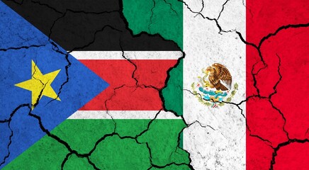 Flags of South Sudan and Mexico on cracked surface - politics, relationship concept