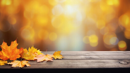 Naklejka na ściany i meble Autumn maple leaves on wooden table.